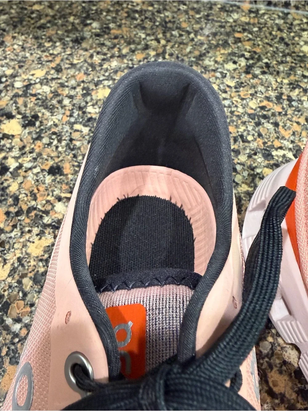 On Cloud Running Shoes in white with Orange Accent ladies 9